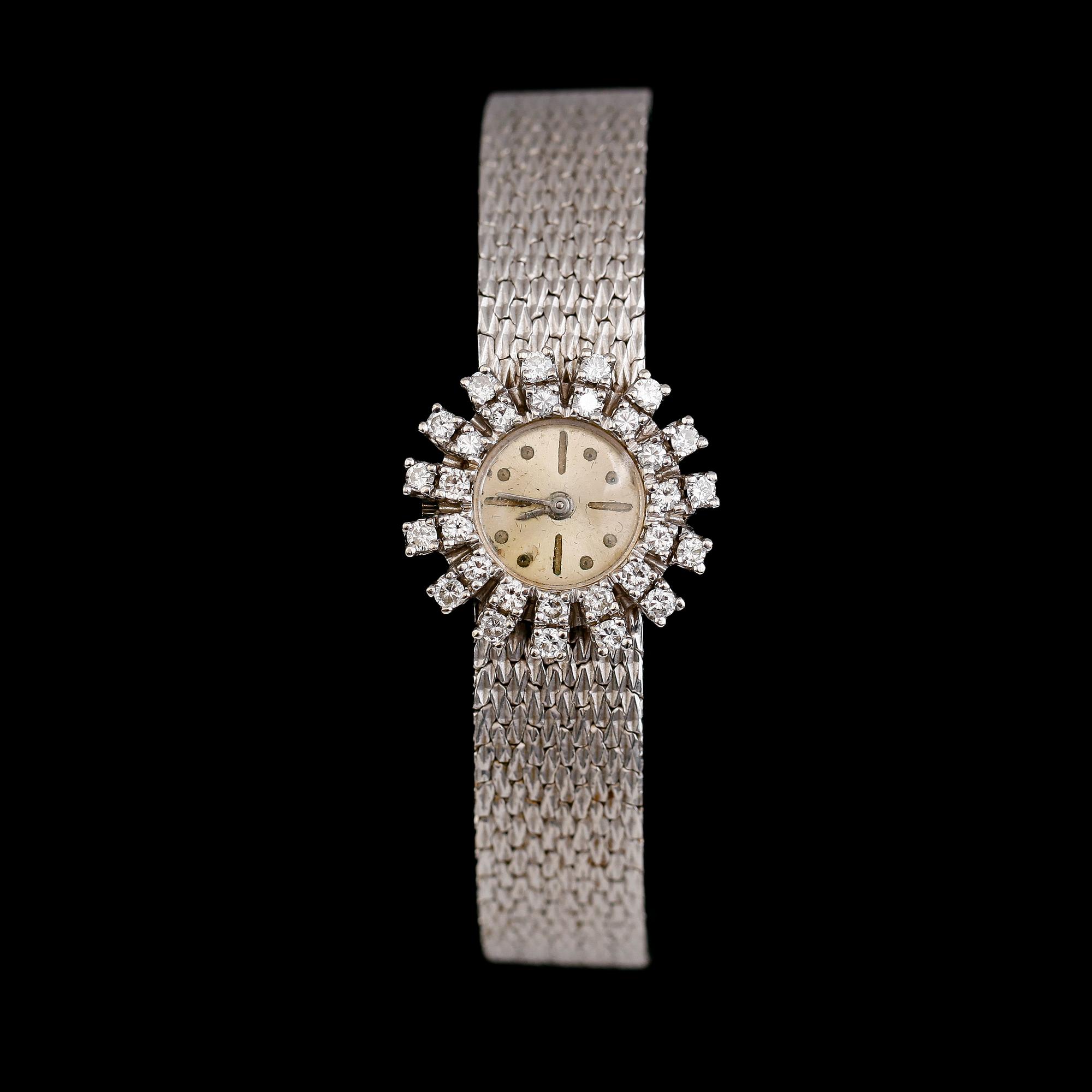 ARMBANDSUR, 14 k vitguld, briljantslipade diamanter. Vikt ca 30,2 g.