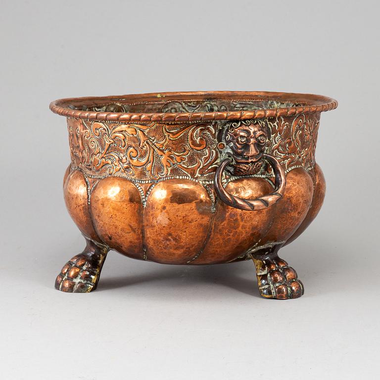 A 19th century copper champagne cooler.