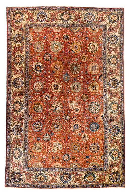 A carpet, a semi-antique Tabriz, ca 528-535 x 346,5-352,5 cm, signed Farhan.