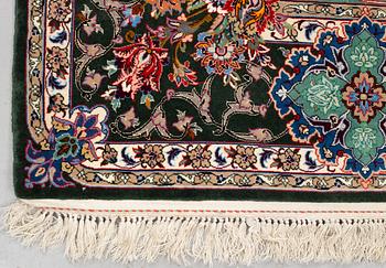 A rug, old Esfahan, part silk, signed, ca 225 x 149 cm (ca 1,5-2,5 cm flat weave at the ends).