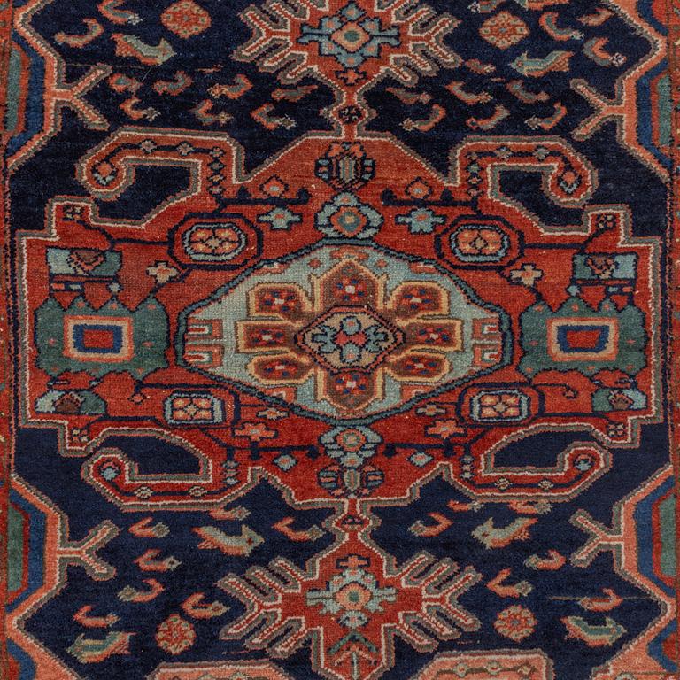 A Heriz rug, c. 192 x 133-139 cm.