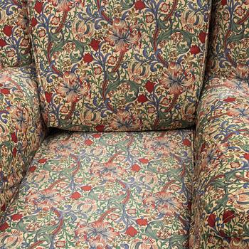 A "Djursholm" armchair with ottoman, Sweden, early 21st century.