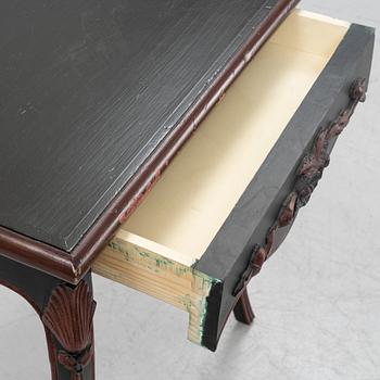 A painted table with a drawer, 20th Century.