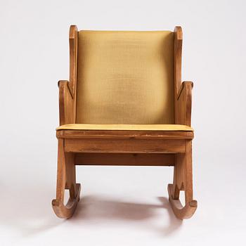 Nordiska Kompaniet, a Swedish Modern stained pine 'Lovö' rocking chair.
