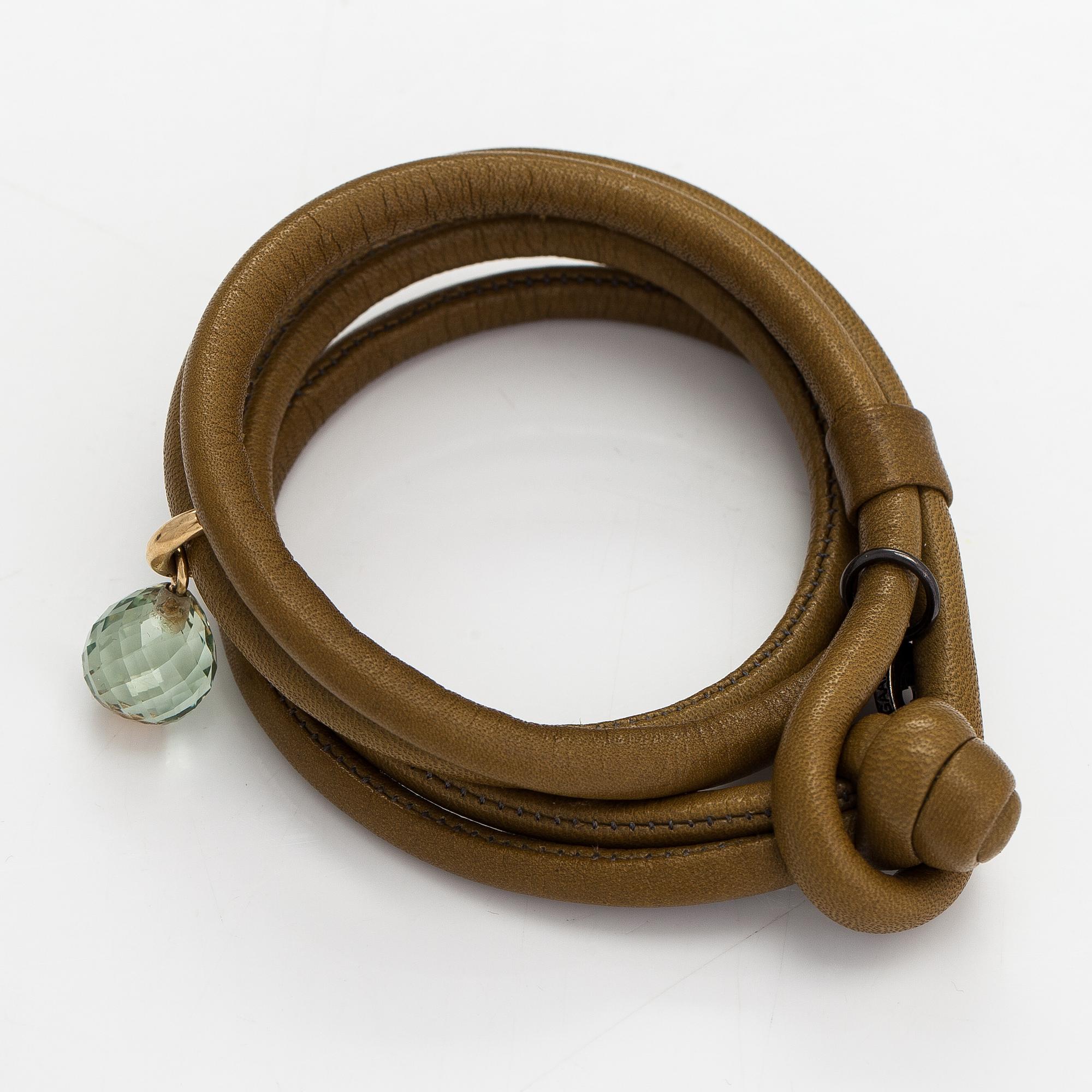 Ole Lynggaard, A 'Sweet drops' bracelet in leather with an 18K gold and green amethyst pendant. Denmark.
