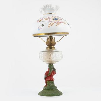 A early 20th century glass kerosene lamp.