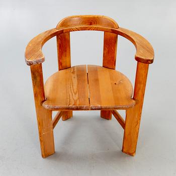 A 1960/70s pine armchair.