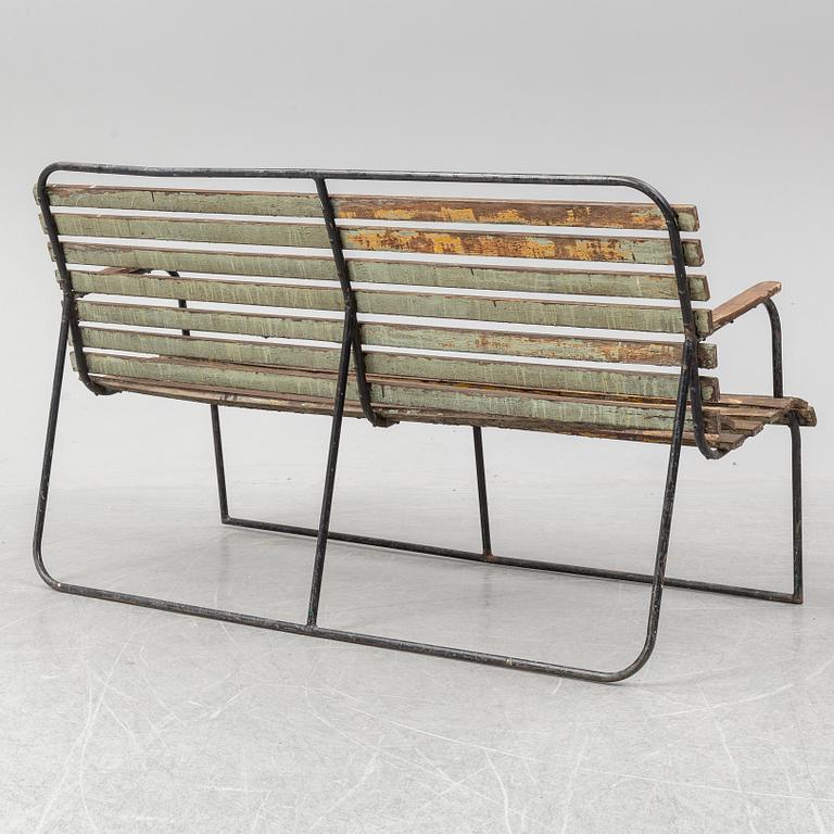 A garden sofa and armchair, mid 20th Century.