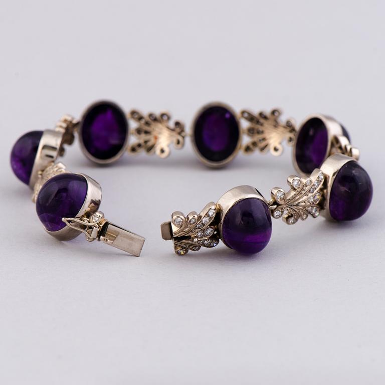A NECKLACE, BRACELET, EARRINGS and RING, amethysts, diamnonds, 18K white gold and palladium. A. Tillander, 1970s.