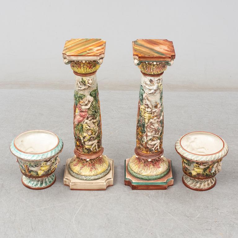 A pair of second half of the 20th century cream ware pedestals with flower pots, Capo di Monte, Italy.