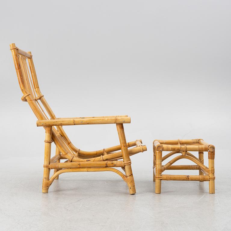 An easy chair with foot stool, end of the 20th century.