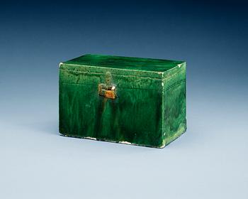 A green and yellow glazed potted figure of a chest, Ming dynasty (1368-1644).