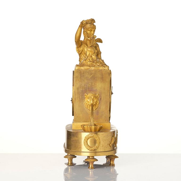 A French Empire figural mantel clock, early 19th century.