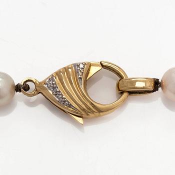 A cultured Akoya pearl necklace, clasp in 18K gold set with eight-cut diamonds. Swedish control mark.