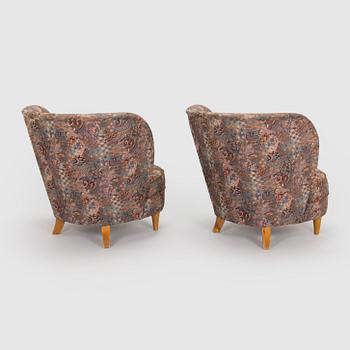 A pair of mid-20th century armchairs.