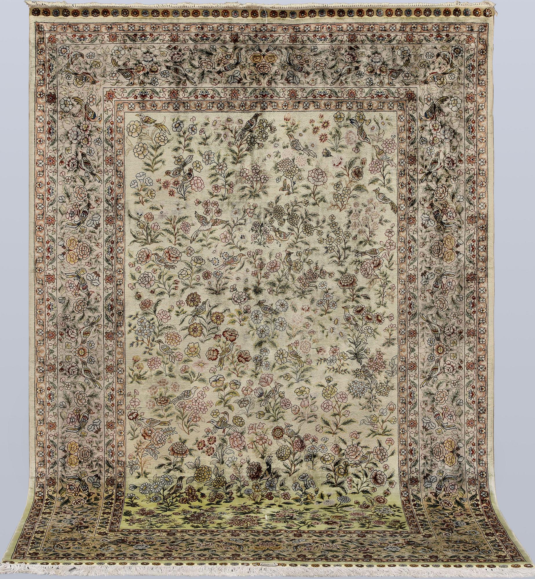 A oriental silk rug, 183 x 129 cm.
