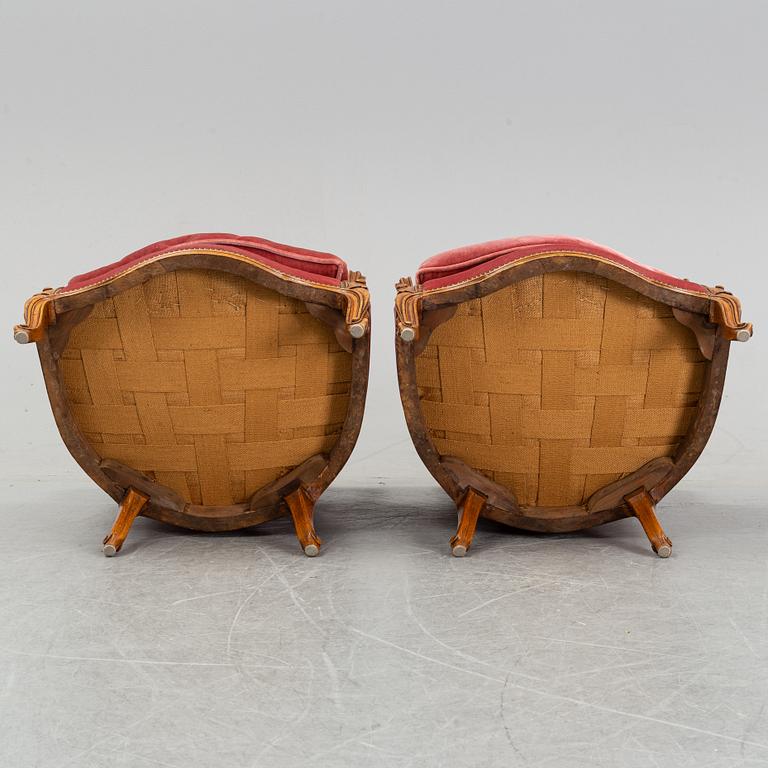 A pair of rococo style easy chairs from around the year 1900.