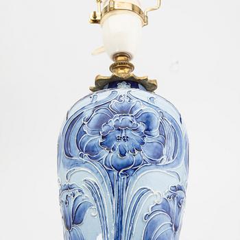 A  William Moorcroft Macintyre porcelain table lamp around 1900.
