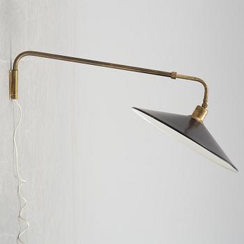 A 20th century brass and painted metal swing-arm wall light.