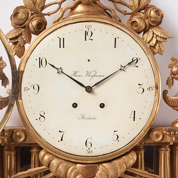 A Gustavian giltwood cartel clock by H. Wessman (watchmaker in Stockholm 1787-1805).