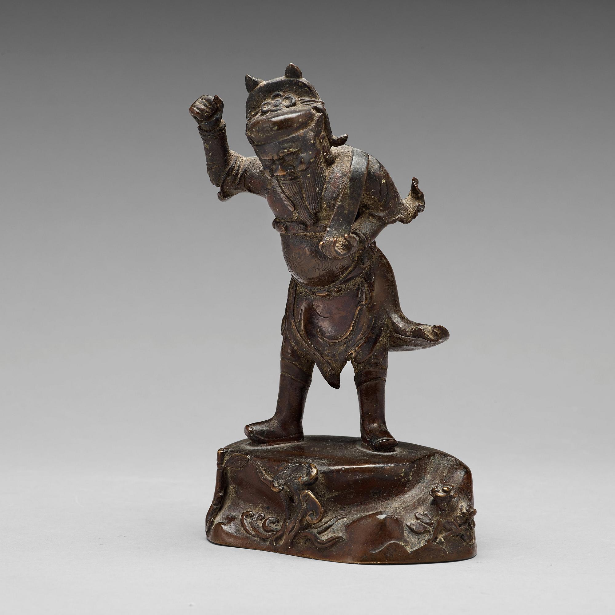 A bronze figure of a deity, Qing dynasty, 17/18th Century.