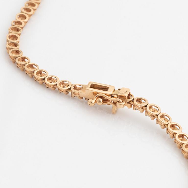 18K rose gold and brilliant cut diamond necklace.