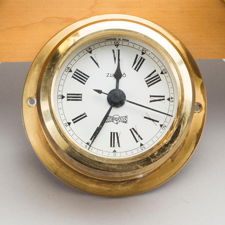 TWO BRASS MARINE CLOCK AND A BAROMETER BY STOCKBURGER.