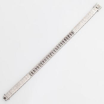 An 18K white gold bracelet, with round brilliant-cut diamonds totalling approximately 1.44 ct. Swedish import stamp.