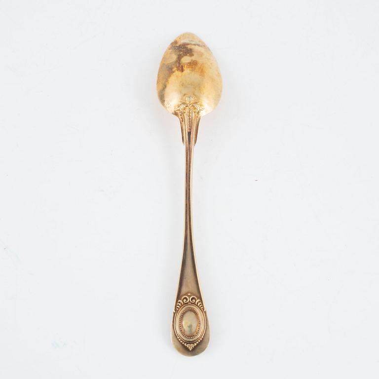 Philippe Berthier, 13 spoons, a sugar tongs and a tea strainer, gilded silver, Paris, France, 1841-51.