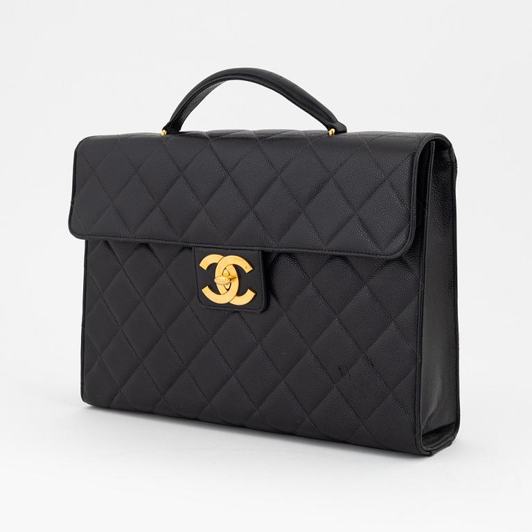 Chanel, a black caviar leather briefcase.