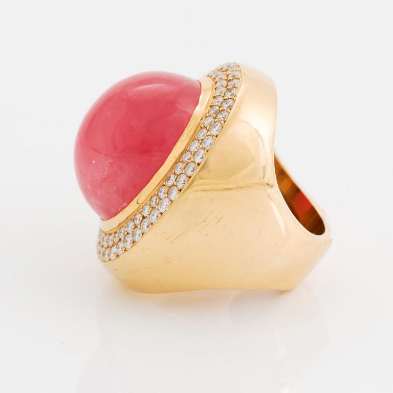 An 18K gold and rhodochrosite Acchinelli ring set with round brilliant-cut diamonds.