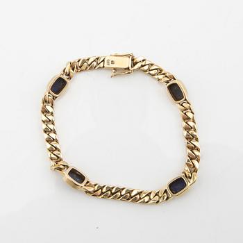 Bracelet curb chain 14K gold with Lapis Lazuli.