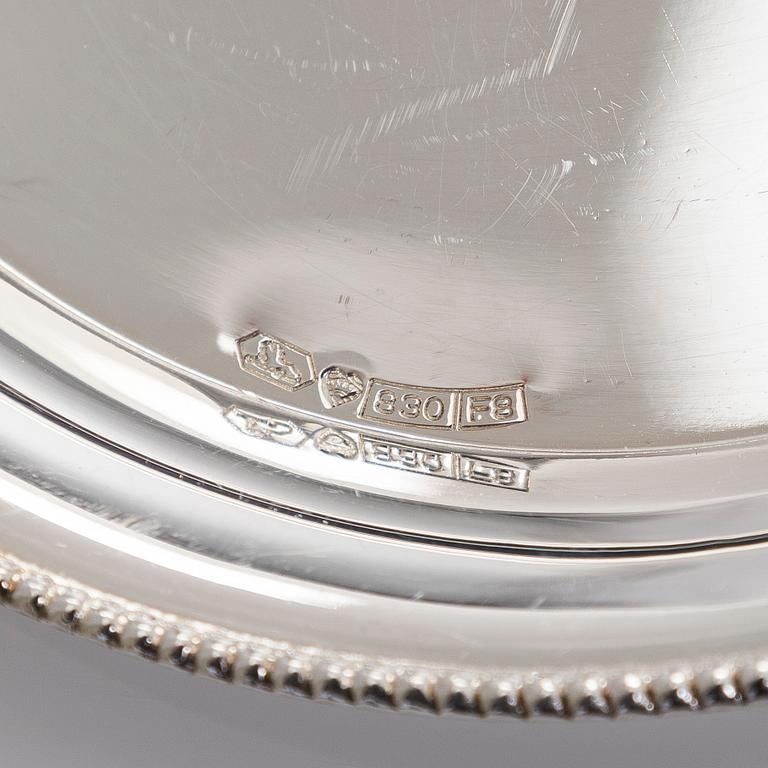 A set of 12 silver glass coasters, Auran Kultaseppä Oy Turku 1935 and 1983, and cocktail sticks, 12 pcs silver.