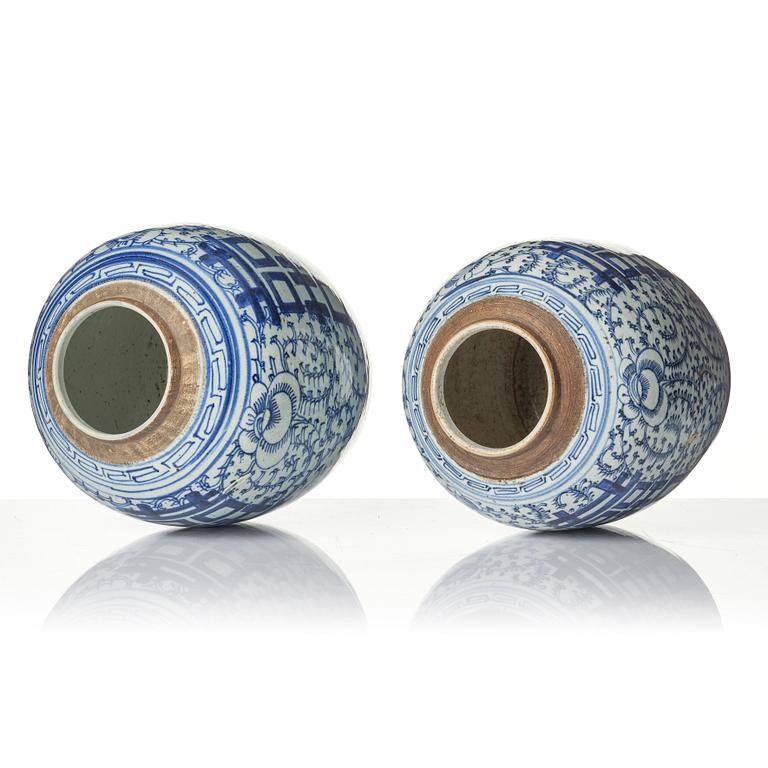 A pair of blue and white porcelain pots with covers, China, 19th century.