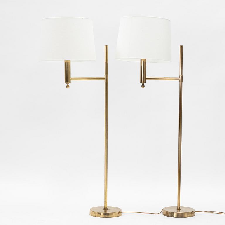 A pair of model 'G-18' brass floor lights, Bergboms, second half of the 20th Century.