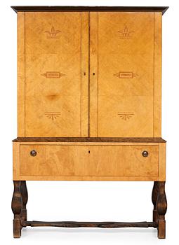 A Carl Malmsten "Haga" stained birch cabinet on stand, Nordiska Kompaniet ca 1924.