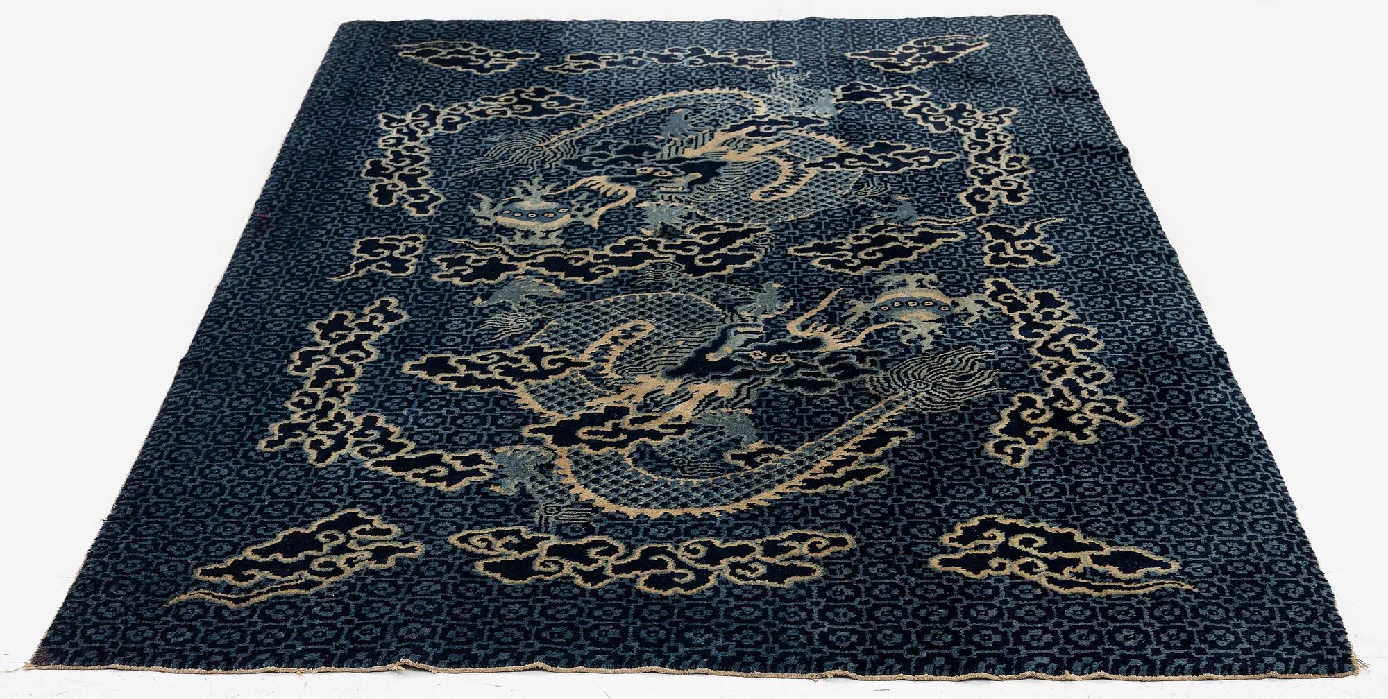 A Chinese 'dragon' rug, circa 1920. (c 190x122 cm).