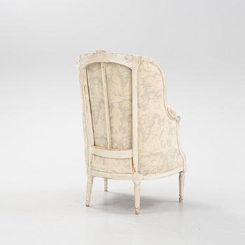 A carved French Louis XVI style bergère, 19th Century.