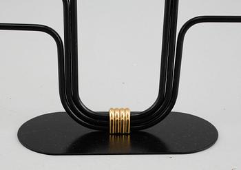 A candelabrum and one camdelstick by Gunnar Ander for Ystad Metall, 20th century.