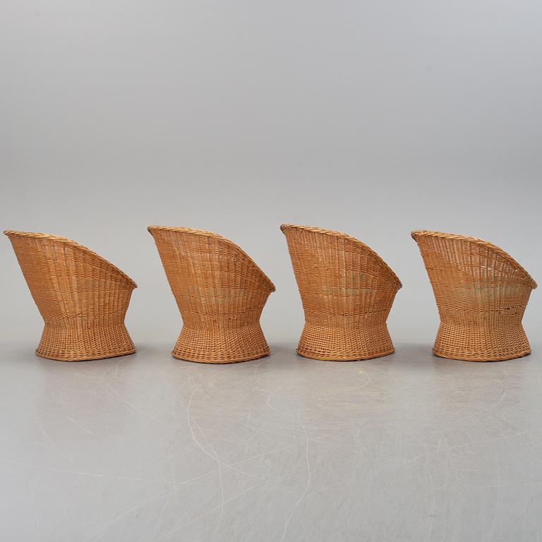 Four second half of the 20th century rattan easy chairs.