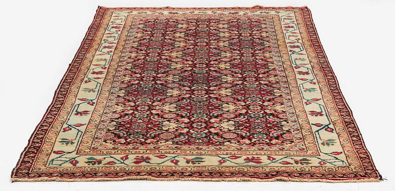 An antique Agra carpet, Northern India, c. 272 x 150 cm.