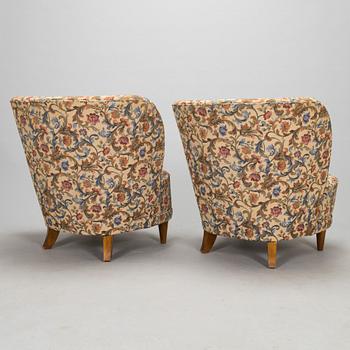 A pair of mid-20th-century armchairs.