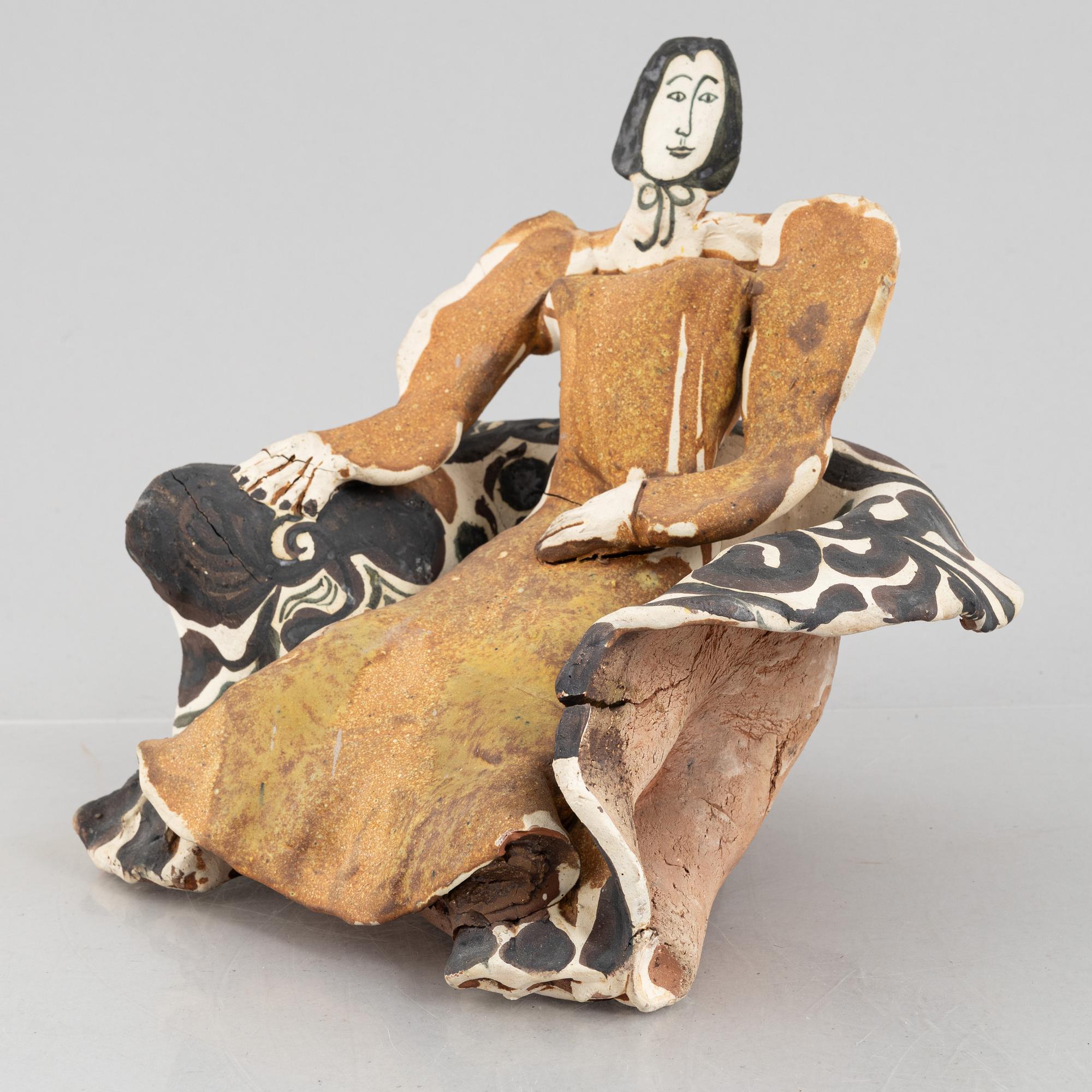 Ulrica Hydman-Vallien, a stoneware sculpture of a seated woman, executed in her own workshop, Sweden.