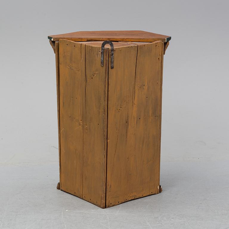 A painted corner cabinet, dated 1794.