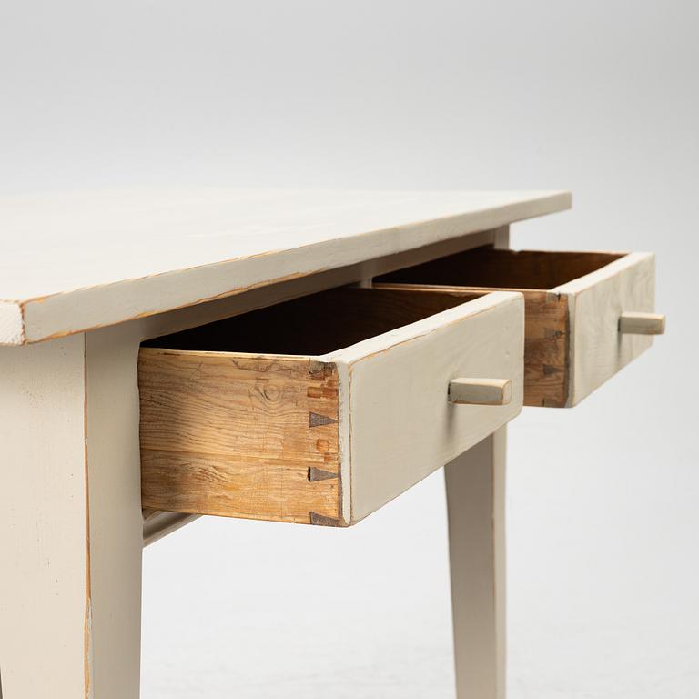 A drop-leaf table, late 19th century.