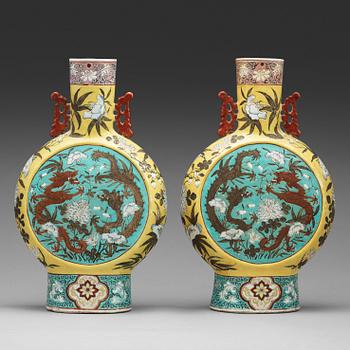 266. A pair of famille rose vases, Qing dynasty, late 19th Century.