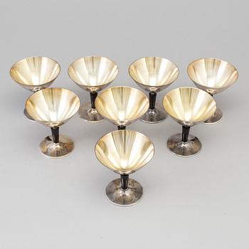 8 pcs of silverplated and bakelite cocktailglasses by Folke Arström.