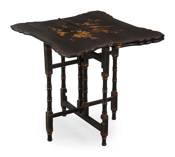 1503. A black and gold laquered games table, 18-19th century.