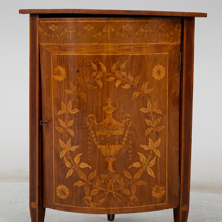 A 19th century corner cabinet.