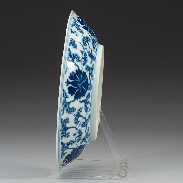 A set of four blue and white lotus dishes, Qing dyanasty with Qianlong sealmark.